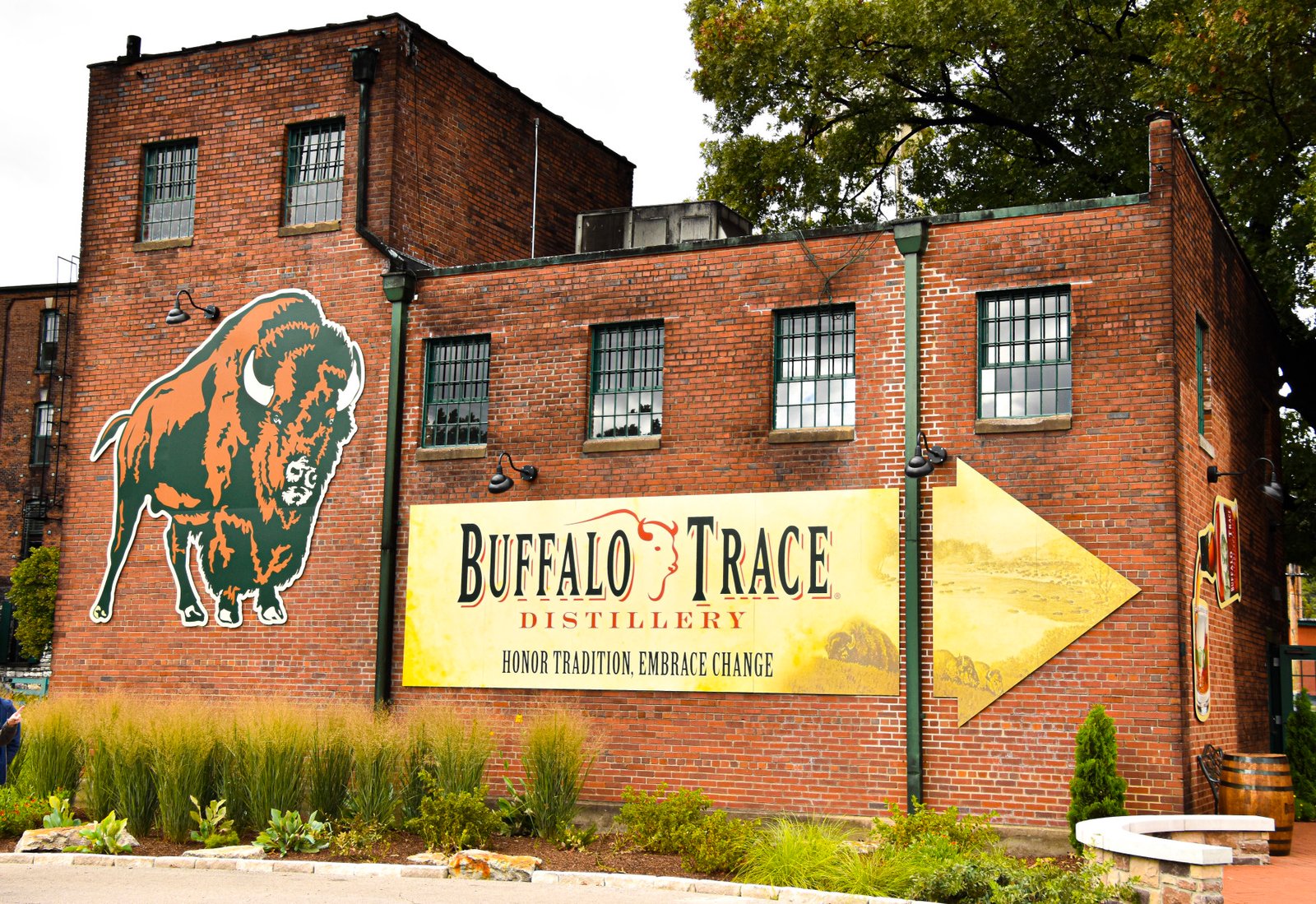 View of the Buffalo Trace Distillery building in Kentucky Bourbon Trail with its logo painted on the brick facade.